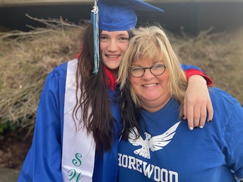 Savannah with her Treehouse Education Specialist Sherry at her high school graduation celebration.
